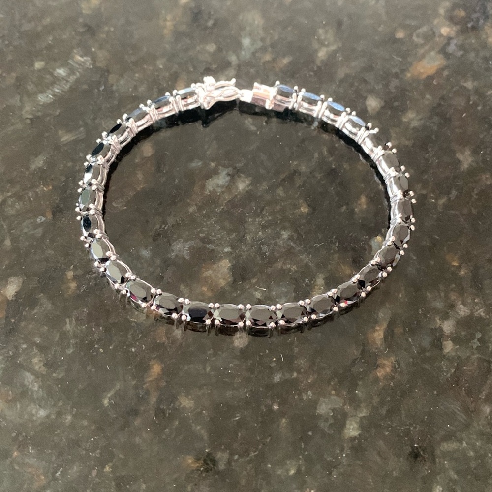 See Berkeley Jewelry Sterling and oval Black Onyx tennis bracelet 7”